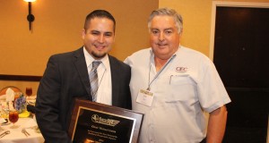 Photo of Mike Garza receiving award from Joe Nix.